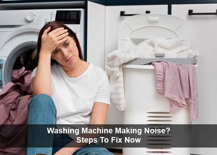 woman sitting in front of a washing machine